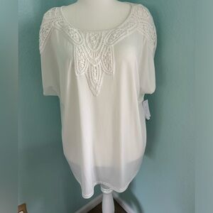 Brand new with tags. Beautiful flowy house with lace neckline